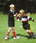 The ball cannot be pulled or wrestled from the ball carrier s hands at any time. Players must always have two tags affixed to their belt whilst taking part in the game.