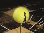 At lower speeds, the flow separation occurs prior to the apex and introduces a swirl effect behind the tennis ball that is known as the wake region.