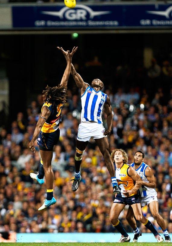 West Coast s Nic Naitanui and North Melbourne s Majak Daw show their athleticism in the round eight clash