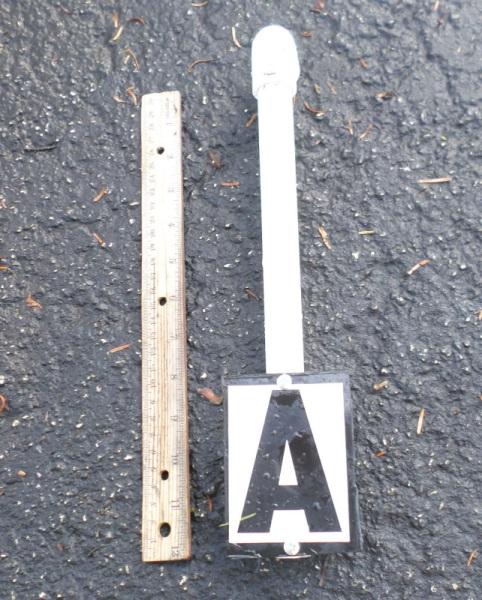 Attach 3-inch lettering (Home Depot model #847015, Internet #202982489, Store SKU#881277) to the flat, smooth side of the ABS sheet.