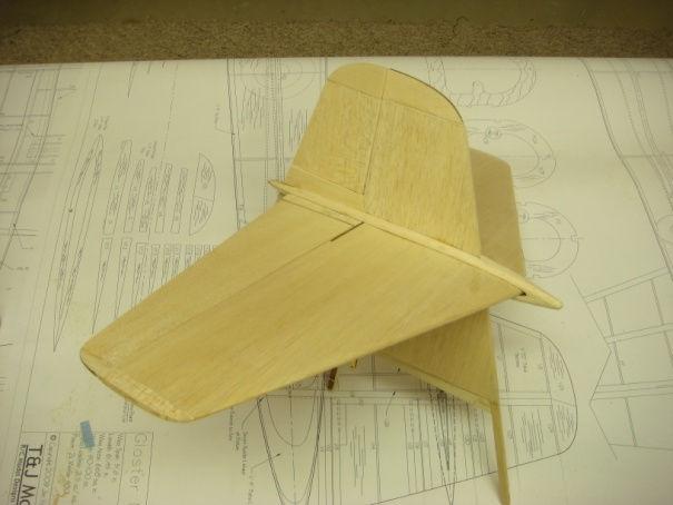 remaining ribs in place. Sand the T.E. to match the ribs. Wings Notch the center piece of V10 to accept the rudder linkage and glue in place.