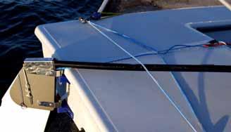 Make sure the rudder stop is securely over the lower pintle section so that the rudder will not be lost during a capsize/inversion.