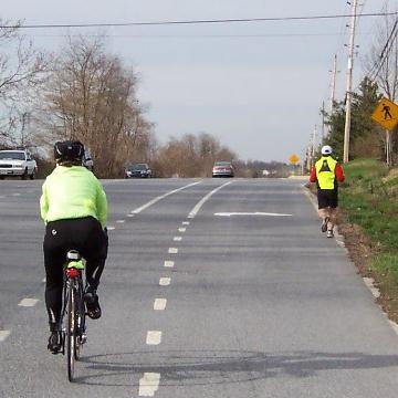 Figure 4 shows Bike Delaware s preferred solution to this problem: a marked offset to the left of the right turn only lane connected to the shoulder.