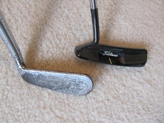 Fred Saunders, straight line model, cast Alum. Head with a large back lobe, replacement shaft w/ a dryed grip, unusual, fair condition.