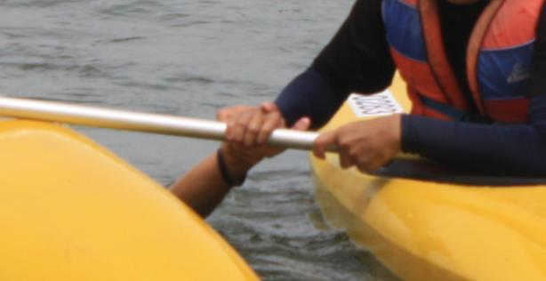 The kayaker grabs the nearest hand of the victim and