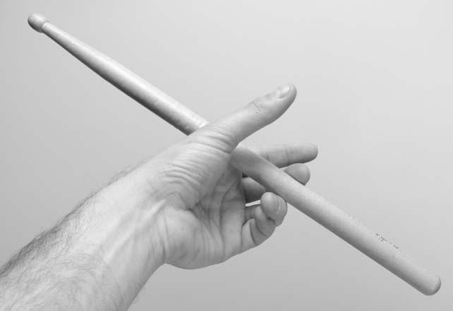 Without making the grip a proper traditional or normal grip, it is virtually impossible to play more than one stroke with any strength or control whilst backsticking.