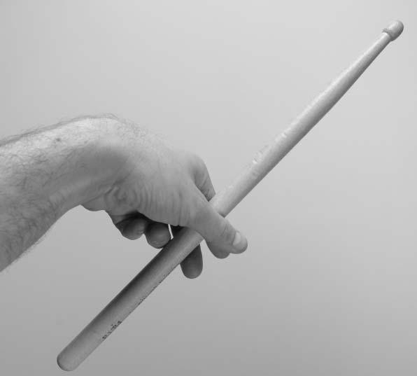 Remember we want to end up with the new fulcrum just behind the middle of the stick, so as you begin to rotate the forearm, let go of the stick with the thumb and grip it between the second