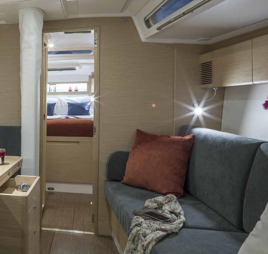 The spacious saloon has a large dining table with integrated wine bottle compartment on port side and can accommodate 6 guests comfortably.
