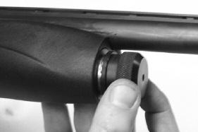 Insert the barrel extension into the receiver (between the bolt and the receiver) while making sure the barrel lug is aligned with the