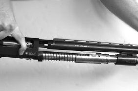 With the barrel extension partially inserted into the receiver between the bolt and the receiver, pull the bolt cocking handle to the