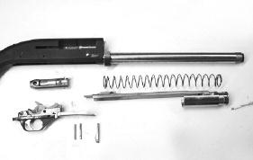 With the cocking handle removed from the bolt you now can grasp the gas piston and slide the bolt and action bar forward and remove the assembly from the magazine tube and