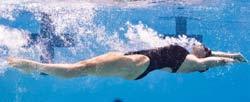 At the same time, the other arm recovers across the body, enters the water in the same position as in the front crawl and pulls to the hips. 4.