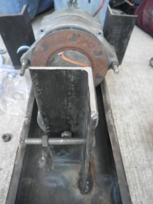 Figure 14: One of two bolts that attach the alternator to the tray A greased bolt on the opposite side of the cylinder went through the vertical support