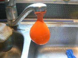 3. Take one standard round balloon and attach it to the tap.