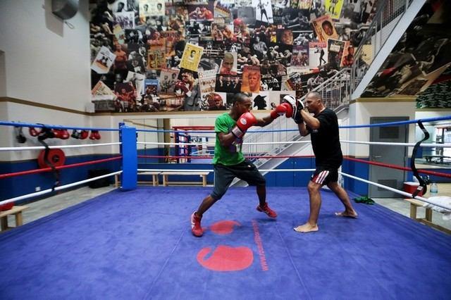 Page 1 of 5 Filipino boxer Larry Abarra, left, throws punches with trainer Morovan Viorel at the Round 10 Boxing Club ahead of his bantamweight bout on Thursday night in Dubai.