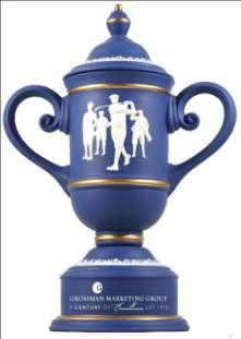 Orrefors Pinnacle Award Golf Ball adorns the top of a large