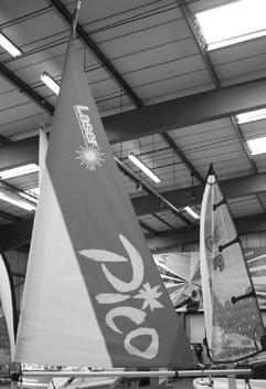 For convenience after sailing, the mainsail can temporarily be stowed by wrapping the sail around the mast in a clockwise direction and positioning the clews webbing strap over the integral plastic