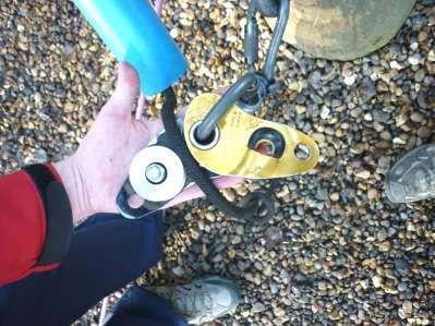Ensure the loose end comes out the back of the pulley nearest the pole and on the same side as the protraxion.
