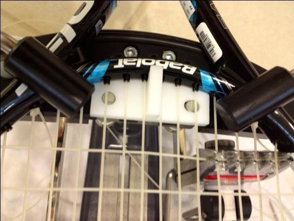 The risers are also sturdy pieces on which the internal racquet supports reside.