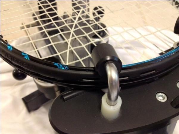 The risers can be adjusted to accommodate racquets with head length up to 16 inches. After adjustment the risers need to be locked using the locking handles.