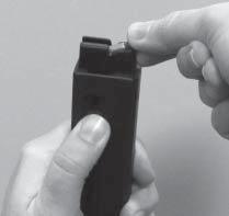 Insert the cartridge under the magazine lips, at the same time pushing down the follower (fig. 6). Do not use excessive force. Remove empty chamber indicator (blue tab).