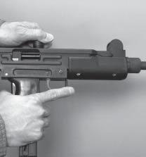 8 5 Firing Grasp Uzi Rifle with one hand on forearm and other hand on grip, grasp Uzi Pistol with one or both hands on grip with index finger resting along outside of trigger guard.