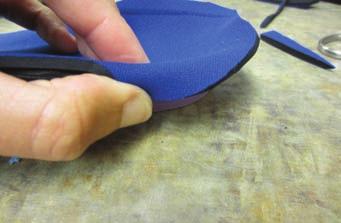 away from an irritating heel rim (b) topcover added to the device which extends proximally to cover a prominent heel rim of the orthotic device (c) Moleskin applied to a lateral orthotic heel rim for