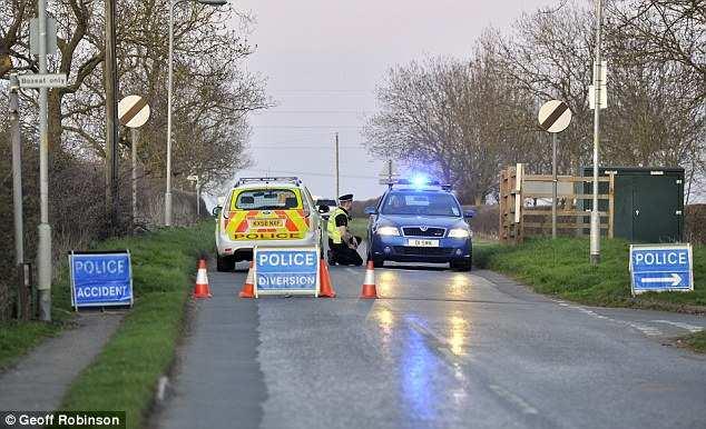 Blocked: Police diverted traffic away from the scene as the trio were trapped above ground for five hours Read more: http://www.