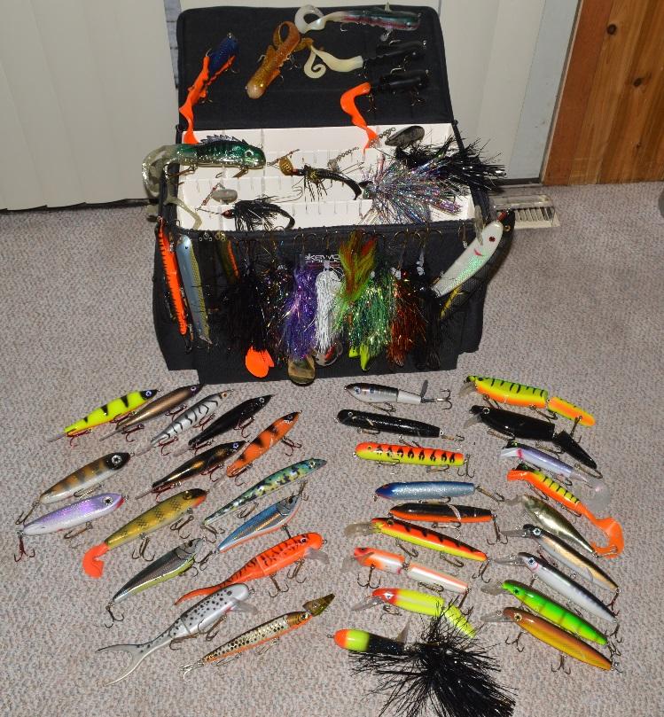 Lot #25: Lakewood Medium Muskie Tackle Box and Lure Package All items pictured in photo are included in this lot. Lakewood medium tackle box with the following lures in it.