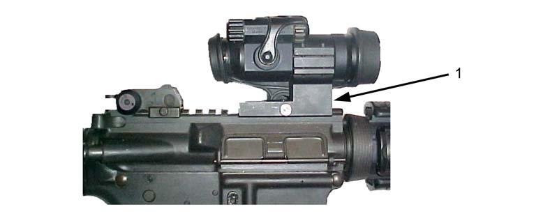 The half-moon spacer (1) should be installed to raise the M68 above the front sight post but the M68 can still be fired without the spacer.