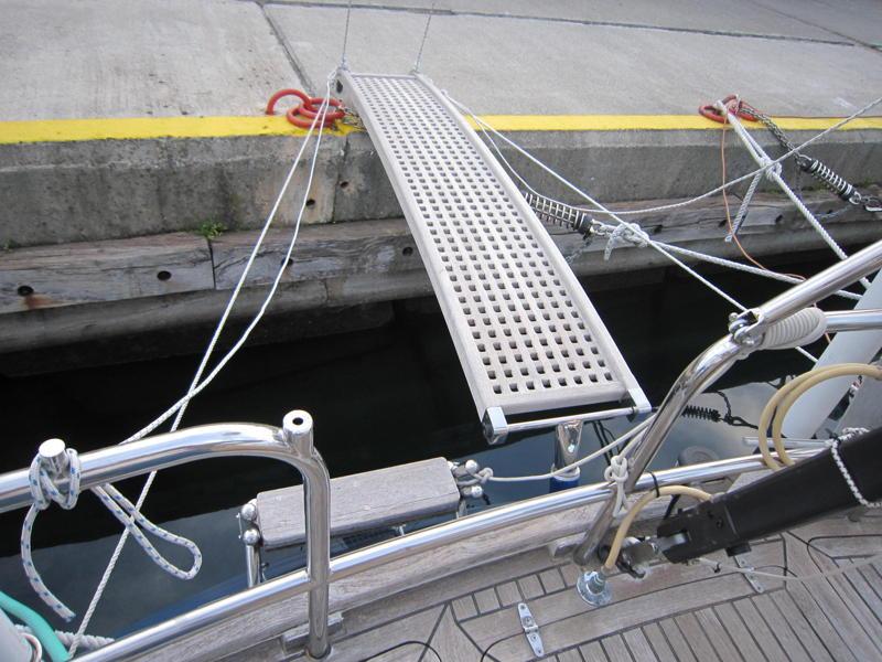 Indigo s passerelle, is used for mooring Med style. It is approximately 9 ft. long and made using laminated teak stringers, with a bowed shape to give it strength.