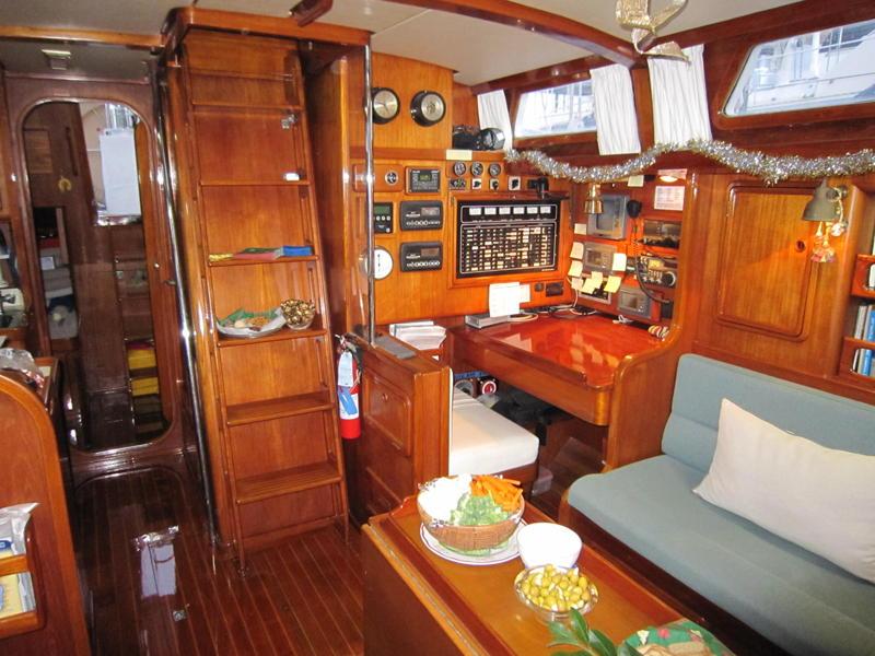 The entryway at the base of the companionway is open to a double quarter berth and tool chest to starboard.