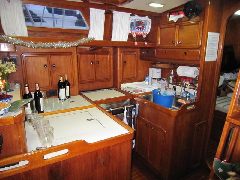The seagoing galley is designed for use by one person in all weather conditions. Under the entire forward counter is a large refrigerator with three levels available through top and side openings.