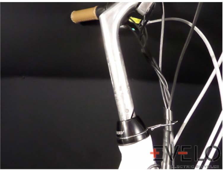 STEP 3 : ATTACH HANDLEBARS 1. Place the black cap over the large silver nuts and use the wire clip to capture the wires. FIG 8. CORRECT BRAKE HOUSING FIG 9.