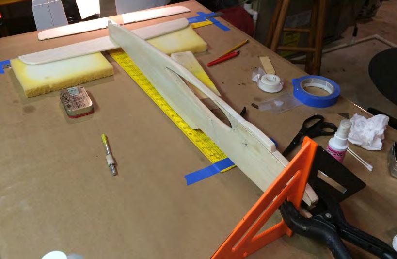 to the fuselage. I cut a square hole between the doublers, angled it along the land gear mounts, and then epoxied in a piece of ½ x ½ hard wood.