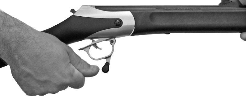 INSPECTING with your finger away from the trigger and with the hammer in the AT REST position (FIGURE 8), open the action to inspect by pushing forward on the trigger