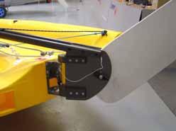 To lower the rudder, slacken the wing nut, pull the down haul line until the rudder blade is fully down, position the down haul line in the cleat and finally retighten the wing nut.