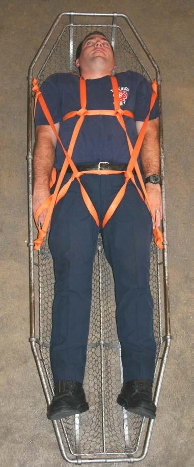 3. Tie an overhand knot in the webbing on each side at the point it passes through the triangle. (Figure 50) Figure 50 4.