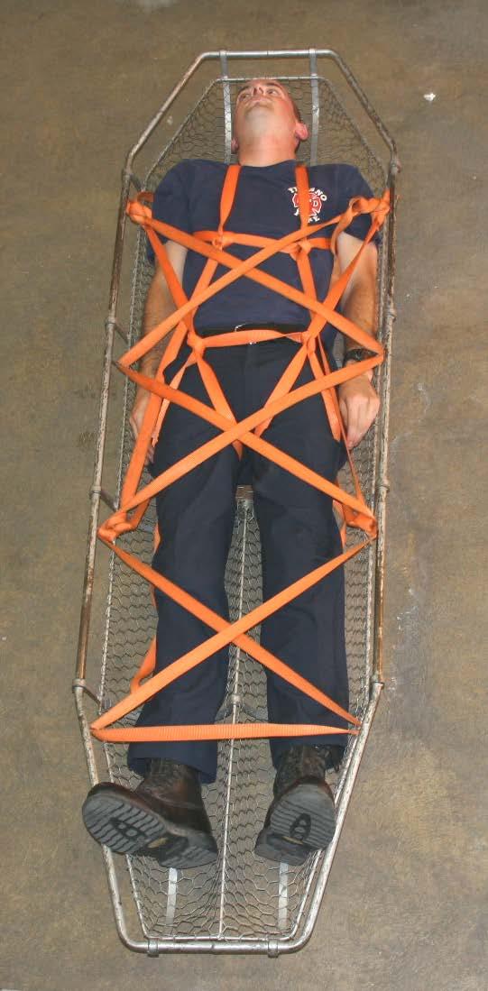 Exterior Lash 1. Place a 20-foot piece of webbing across the victim's legs with the midpoint at or below the knees. 2. Pass the ends of the webbing around the rib at or below the victim's knees on both sides where the rib meets the main frame.