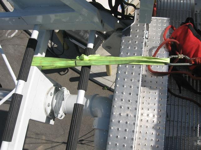 This change of direction pulley is attached to the swing arm by way of a green webbing and carabiner, as seen in Figure 59.