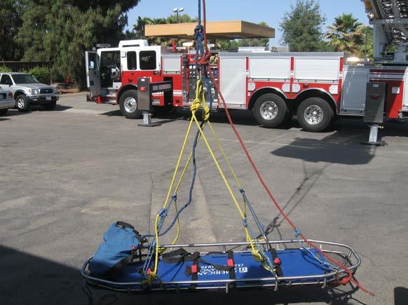 system hangs can be controlled by extending/retracting and raising/lowering the ladder, as this entire apparatus hangs approximately 15 feet from the bottom of the basket, shown in Figure 65.