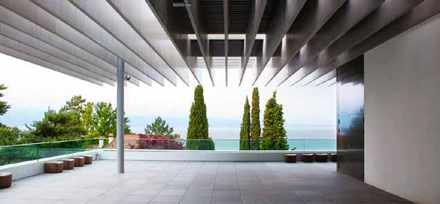 In the warm season, the Gallery opens into a terrace with a panoramic view of the lake and the Alps.