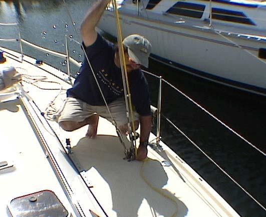Set Your Mast Butt. Loosen all the shrouds to slack. Take the spinnaker halyard around the upper shroud and secure aft to one of the spinnaker sheet block bails in the back of the boat.