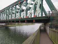 50m span bridge as designed by architects. 4 Widen existing riverside path with asphalt or suitable robust material as far as link to Fen Road.