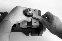 Service & Repair Manual 23. Apply a spanner wrench to one of the larger bore holes of the piston cap(25), and hold it securely seated to tighten the cap clockwise until snug. Do not overtighten.
