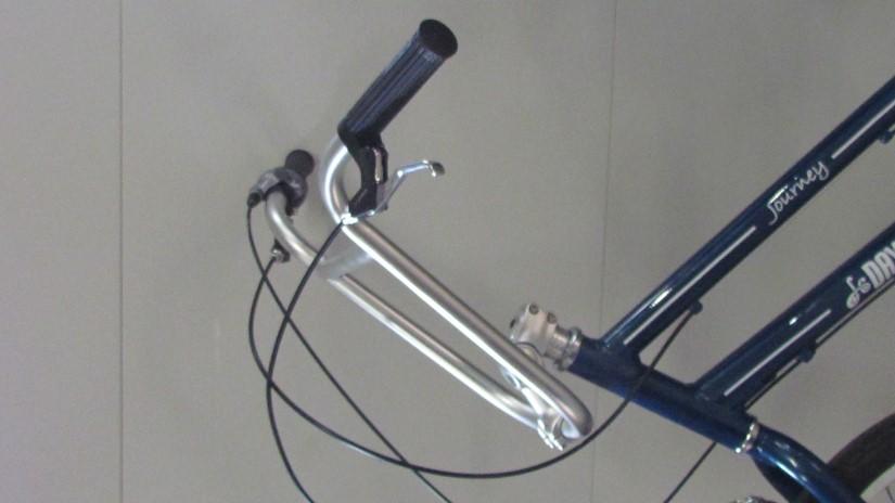To change the height of the handlebars simply loosen the bolt on the side of the stem until you can raise and lower the stem.