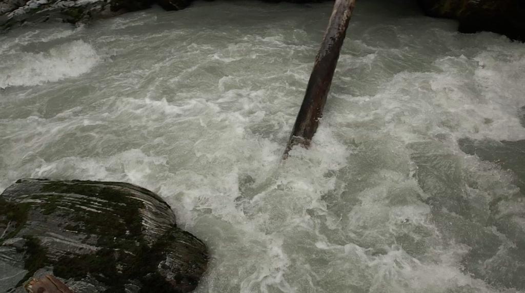 So far, the only possible place we found to cross involved about a five-foot jump onto a partially submerged log, which was positioned a few metres above a waterfall that dropped into a sieve jammed