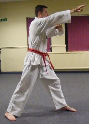 straight fingertip thrust and the right arm extends into an inward