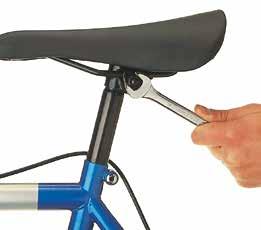 To adjust the saddle fore-and-aft, undo one of the large nuts about two turns, then tap the saddle backwards or forwards with your hand.