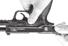 the thumb and fingers while holding the firearm in an upright position, and briskly draw the slide fully rearward in order to extract any cartridge from the barrel chamber and